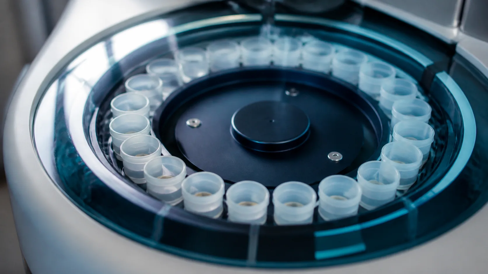 Circular sample carousel of a clinical chemistry analyzer loaded with small cups