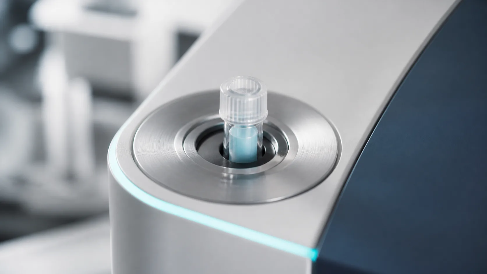 Precision laboratory instrument's sample port with a single small tube seated in it